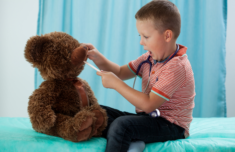 Kindergartener at the pediatrician with his teddy bear